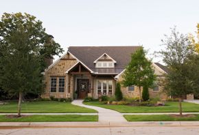 Red Oak and Live Oak trees planted by Treeland Nursery in a frontyard at The Oaks of Argyle in Argyle, TX.